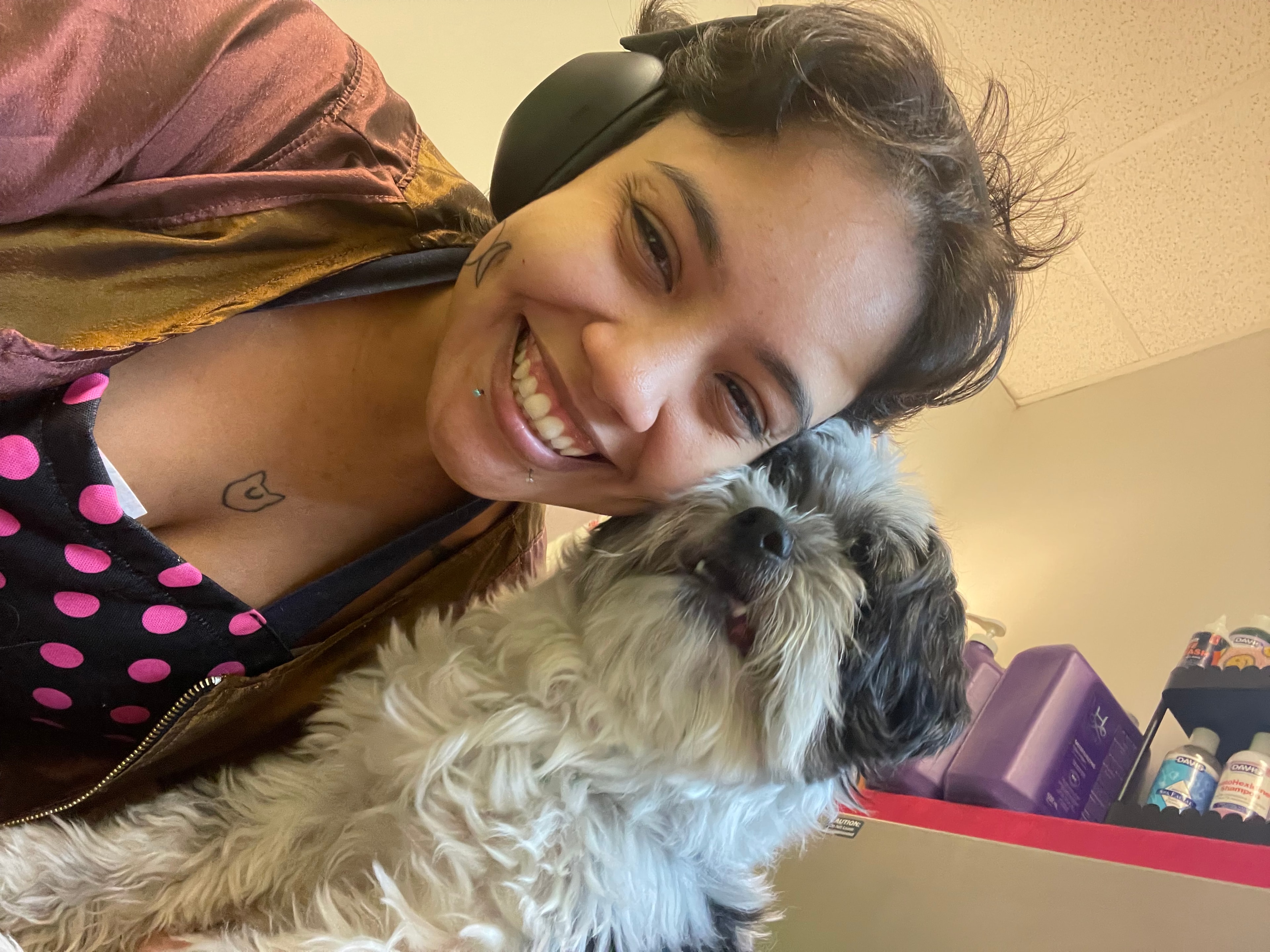 Meagan Rivera with Dallas the Pomchi before his groom at Oodlepaloodles